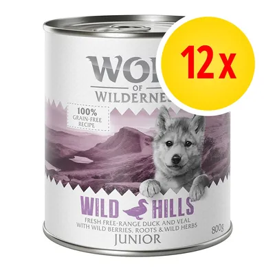 Konzerva Wolf of Wilderness Wild Hills Junior 800g, 100% grain-free recipe, 12x balení. Text: Fresh free-range duck and veal with wild berries, roots & wild herbs.