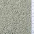 Close-up of light grey granules with a ruler showing particle size from 1 to 9 centimetres for scale.