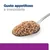 Gusto appetitoso e irresistibile, testo visibile sopra una cucchiaio con alimento umido marrone chiaro.