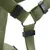 Close-up of a green nylon harness with metal ring and black plastic elements for fastening.