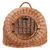 Wicker pet carrier with a round metal door and handle on top, suitable for transporting small animals. Door is secured with a latch.