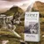 Wolf of Wilderness dog food bag, visible text: 100% grain free recipe, Wild Hills, fresh chicken meat with duck, with wild berries, roots & wild herbs. Wolf and mountain background.