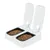 Double automatic feeder with two open compartments, each filled with dry pet food. Both lids are raised to show the food trays inside.
