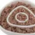 Close-up of wet food in a white anti-gulp bowl with spiral design for slow feeding.