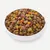Bowl with dry food and fresh ingredients such as pieces of meat, peas, carrots and beans.