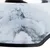 Nahaufnahme einer Oberfläche mit Marmormuster in Weiss und Grau, schwarzer Rand sichtbar.