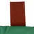 Red felt material on green fabric, possibly part of a product design or accessory.