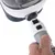 Hand showing how a grey accessory with 'Push' button is inserted into a white device.