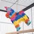 Jouet suspendu en forme d’âne coloré, fait de papier, accroché dans une cage à barreaux métalliques. Crochet métallique et corde visibles pour fixation.