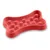 Red bone-shaped feeding tray with raised nubs for slow feeding.