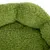 Primer plano de un material verde y suave, posiblemente parte de una cama o cojín para mascotas.