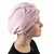 Roze handdoekturban met kattenoren-design, gedragen op het hoofd. Gemaakt van zachte stof voor snel drogen van het haar.