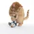 Red cat playing with a fabric mouse on a string. Toy in blue and beige with white accents.