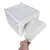 Hand pulls a white cushion from a white perforated box. Product shows functionality and design.