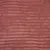 Gros plan sur une surface en tissu rose à texture côtelée, matière pelucheuse visible. Aucun texte ou marque apparente.