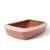 Caja de arena para gatos de plástico rosa con borde color crema, forma rectangular.