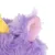 Détail d’une peluche en tissu violet avec une oreille rose et un élément jaune visible, matière duveteuse.