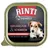Confezione Rinti Finest, testo visibile: Geflügel pur & Schinken, helle Filetstücke, ohne Innereien, ohne Leber. Immagine di un cane parzialmente visibile.