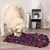 Dog examines a red and blue snuffle mat on a wooden floor. Product for activity and scent training.