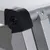 Närbild av en svart plastled på en silverfärgad aluminiumram, synligt fastsatt med skruvar.