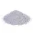Pile of fine, light-coloured granules displayed on a white background, showing the texture and appearance of the loose product.