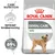 Royal Canin Dental Care Mini hondenvoer, tekst: vermindert tandsteenvorming, bewezen resultaten tot 69% minder tandsteenvorming. Afbeelding van kleine hond op de verpakking.