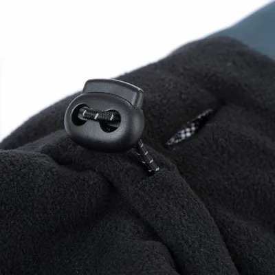 Close-up of an adjustable drawstring with a toggle fastener on a black fleece fabric, showing the tightening mechanism for secure fit.