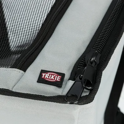 Close-up of a grey Trixie product with black mesh and zip.