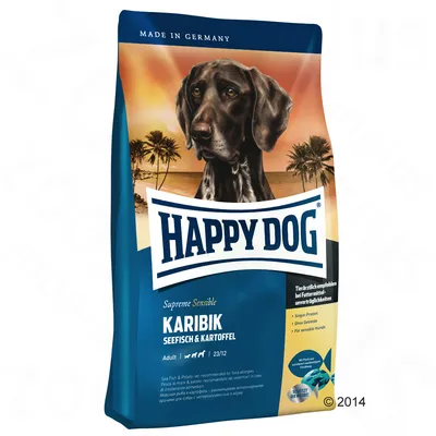 Pienso para perros Happy Dog Supreme Sensible Karibik, seefisch & kartoffel. Adulto. Texto visible en alemán e inglés sobre ingredientes y recomendaciones. Imagen de un perro en el envase.