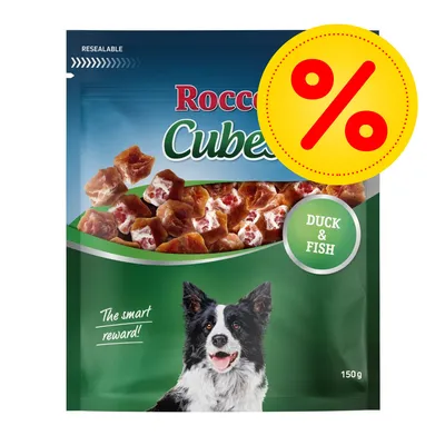 Rocco Cubes Duck & Fish, sachet refermable 150 g avec morceaux visibles, offre spéciale indiquée par un symbole pourcentage rouge sur fond jaune.
