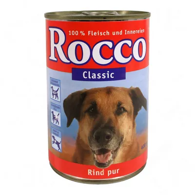 Rocco Classic tinned dog food, 100% Fleisch und Innereien, Rind pur, 400g. Blue and red label with a photo of a dog and icons on the side. Text in German.