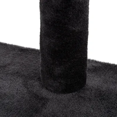 Close-up of a black scratching post trunk and base covered with soft fabric.