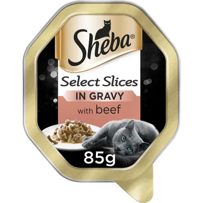 Select Slices in Gravy with beef, 85g. Image shows food pieces on a plate and a grey cat beside it.