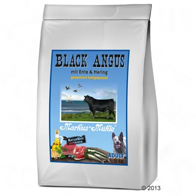 Bag labelled Black Angus with duck and herring, cold-pressed, showing images of beef, fish, oil, grains, and a dog. Marked for adult, 15 kg.