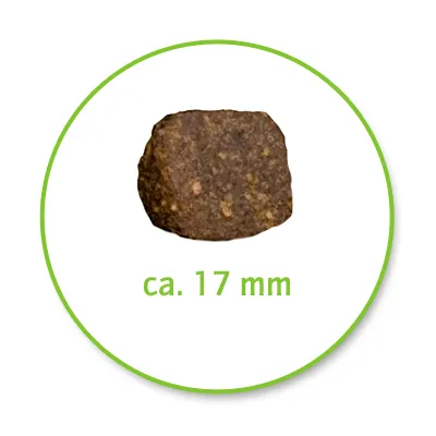 Jednotlivý hnědý kousek krmiva o velikosti cca 17 mm zobrazený v zeleném kruhu.