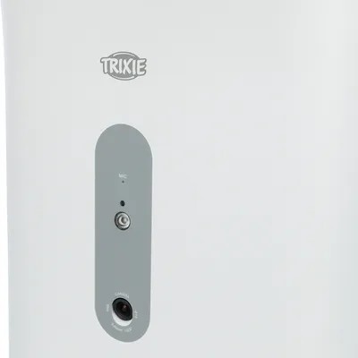 Trixie zařízení s mikrofonem a kamerou, šedý ovládací panel na bílém pozadí.