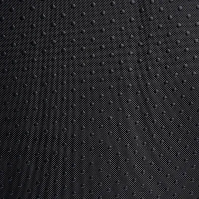Nahaufnahme eines schwarzen, rutschfesten Materials mit kleinen Noppen für besseren Halt.