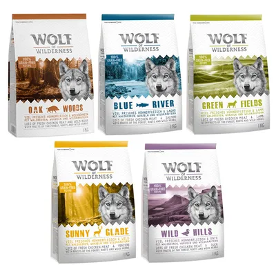Sachets de croquettes Wolf of Wilderness 1 kg : Oak Woods, Blue River, Green Fields, Sunny Glade, Wild Hills. Recette sans céréales, noms et ingrédients visibles sur chaque emballage.