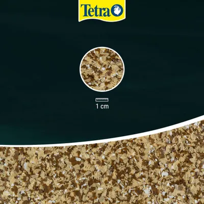 Tetra flake food in close-up, scale shows 1 cm for size reference of the flakes. Tetra flake food in close-up, scale shows 1 cm for size reference of the flakes.