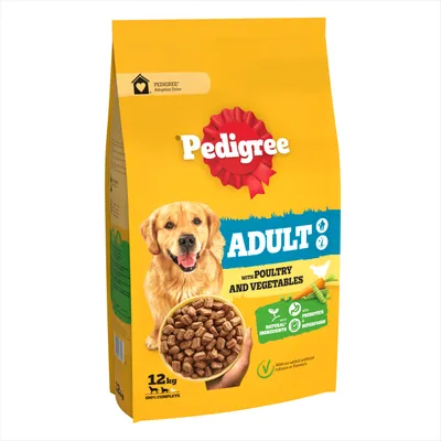 Bag labelled 'Adult' with poultry and vegetables, natural ingredients, prebiotics, superfoods, no added artificial colours or flavours, 12kg. Bowl of kibble shown.