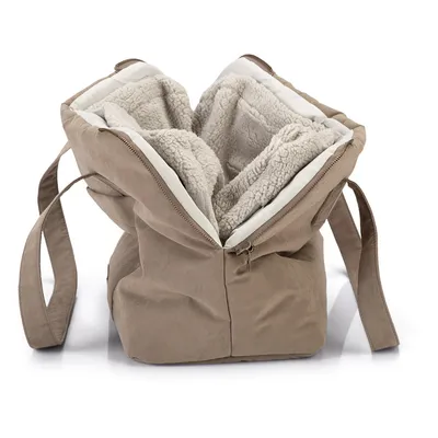 Sac de transport beige pour animaux, intérieur doublé en tissu polaire, fermeture éclair sur le dessus, deux anses visibles. Aucun logo ou texte apparent.