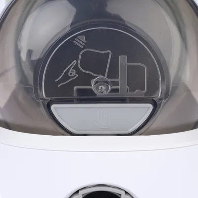 Instructions for use: Press the button to open the lid. Symbol shows a hand and lid movement.