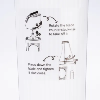 Instructions for blade removal and attachment: Turn the blade counterclockwise to remove. Press the blade down and turn it clockwise to secure.