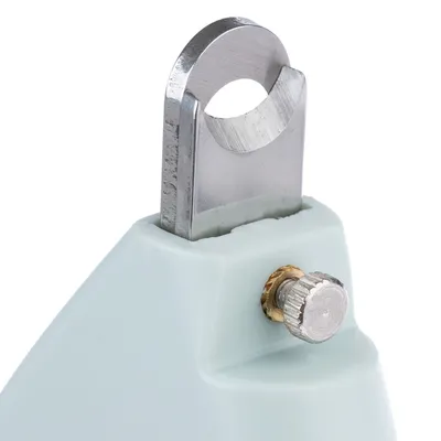 Close-up of a silver cutting blade with adjustment screw on a light blue handle, suitable for precise cutting.