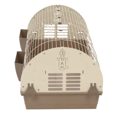 Cage pour petits animaux en métal et plastique beige, deux mangeoires latérales, logo Tiaki visible sur la façade avant.