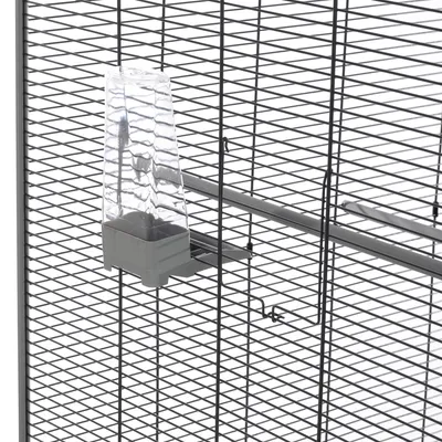 Bird cage with transparent plastic feeder attached to metal grid walls.