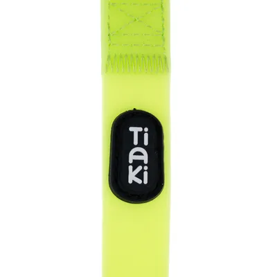 Tiaki logo on neon yellow material with visible seams.