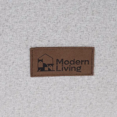 Modern Living. Лого на марката върху кафяв етикет със стилизирана къща и животински мотиви.