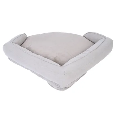 Grey, padded pet bed with raised edge and soft lying surface.