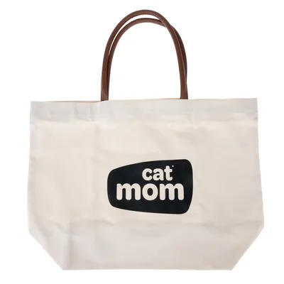 Borsa in tessuto beige con manici marroni e stampa nera 'cat mom'.
